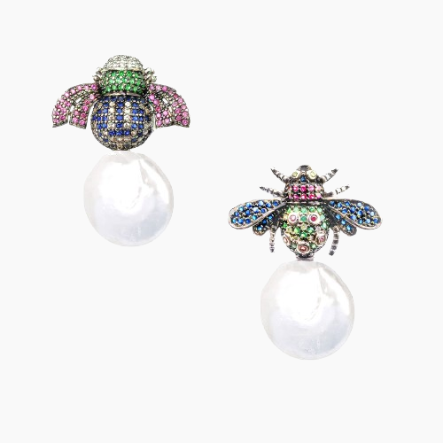 Colorful bee-shaped earrings on a white background