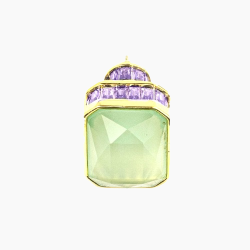 Jewelry pendant with green and purple gemstones on a white background