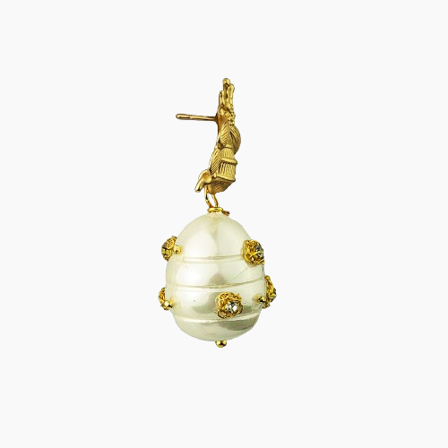 Decorative egg with gold embellishments on a white background