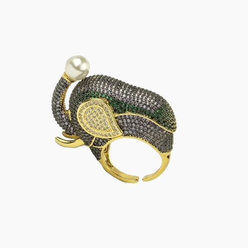 Elegant ring with green gemstones and pearl on a white background