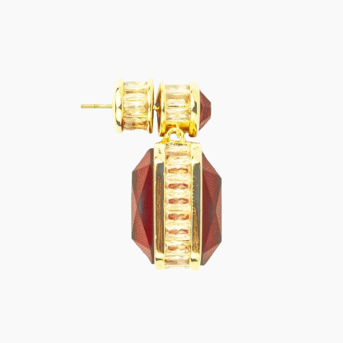 Gold and red earring on a white background
