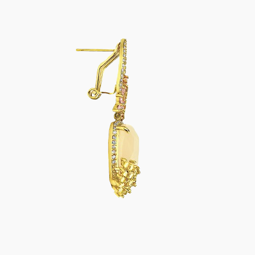 Gold earring with gemstones on a white background