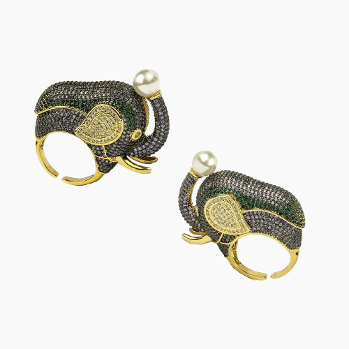 Pair of elephant-shaped earrings with gold, green, and pearl details on a white background