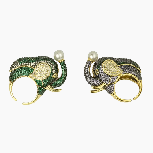 Pair of elephant-shaped earrings with green and black gemstones on a white background