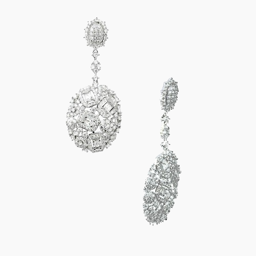 Pair of silver earrings with clear gemstones on a white background