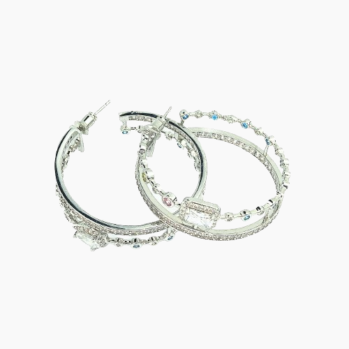 Pair of silver hoop earrings with gemstones on a white background