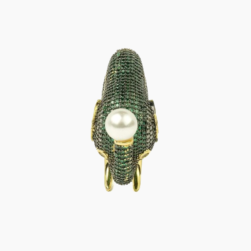 Ring with green gemstones and a pearl on a white background