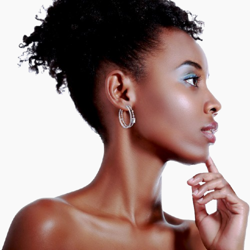 Woman wearing hoop earrings with a neutral background